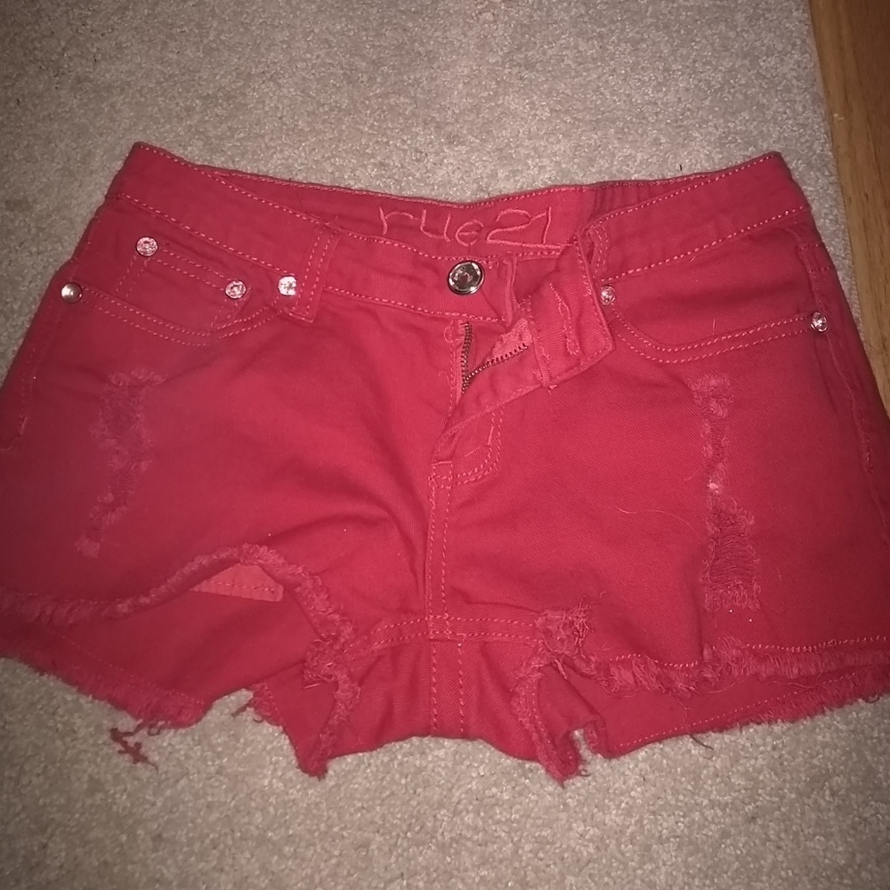 Red distressed shorts